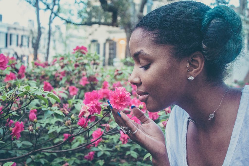 girl smelling flowers